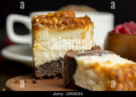 Cheesecake with chocolate sponge cake and peanuts in caramel, delicious dessert with peanuts and cheese cream Stock Photo