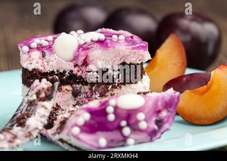 Delicious puff pastry with chocolate biscuits and berry flavor, delicious pastry with butter cream and fruit layer Stock Photo