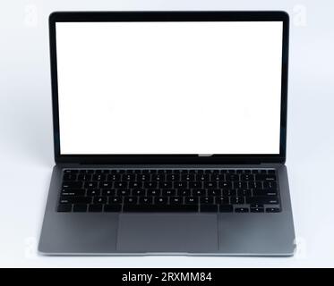 Grey laptop with black keyboard front view isolated on studio background Stock Photo