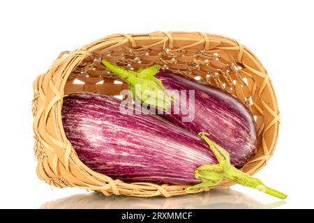 Two ripe eggplants in a basket, macro, isolated on white background. Stock Photo