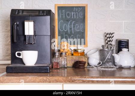 Home Coffee Station, Coffee Bar. kitchen coffee corner with coffee machine, coffee  beans, tea, sweets and toppings for drinks Stock Photo - Alamy