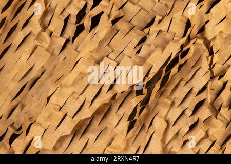 Decorative craft paper with cuts for packaging and decoration, decorative paper close-up is used to decorate flowers and other gifts Stock Photo