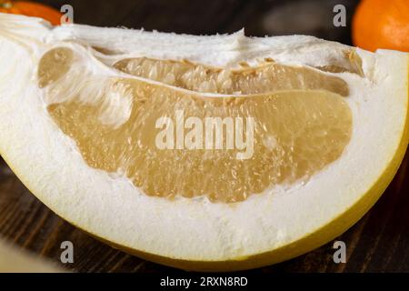 ripe yellow pomelo cut into pieces close-up, delicious fresh yellow pomelo cut into slices Stock Photo