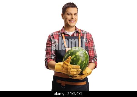 Farmer holding a watermelon and smiling isolated on white background Stock Photo