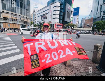 A Japanese man wearing a Donald Trump mask stands in the street near the Shibuya Crossing in, Tokyo, Japan Stock Photo