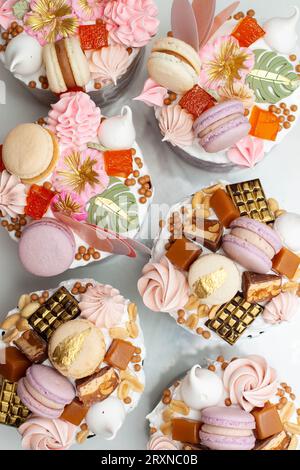 Set of beautiful traditional orthodox cakes decorated with glaze, meringues, chocolate, nuts, toffees, macaroons and jelly Stock Photo