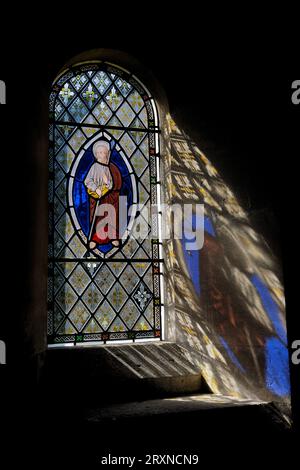 Stained Glass Window reflections at Hawley Church Stock Photo