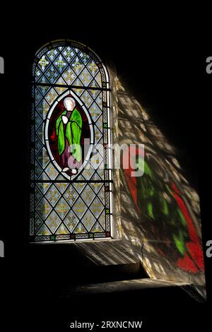 Stained Glass Window reflections at Hawley Church Stock Photo