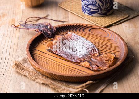 dried squid on wooden table Stock Photo