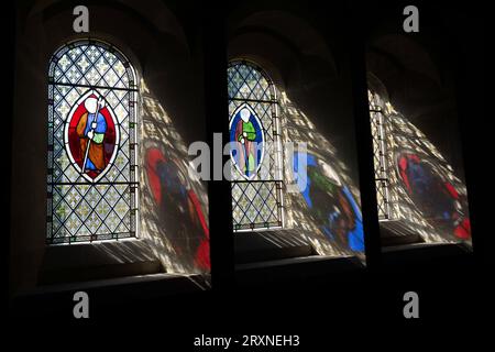 Stained Glass Window reflections at Hawley Church Stock Photo