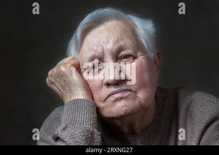 Portrait of an elderly woman in the studio, close-up Stock Photo