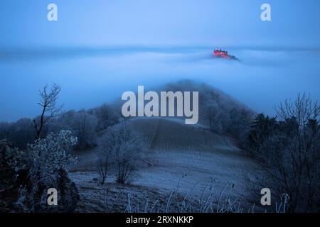 Hohenzollern Castle with Christmas lights in the fog from the Zeller Horn, Hechingen, Swabian Alb, Baden-Wuerttemberg, Germany Stock Photo
