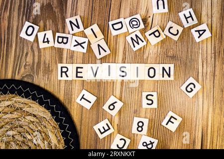 Revision flat lay scattered letters with straw mat Stock Photo