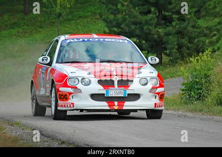 Italy - September 7, 2005 - Unidentified drivers on a white and red vintage MG ZR racing car Stock Photo