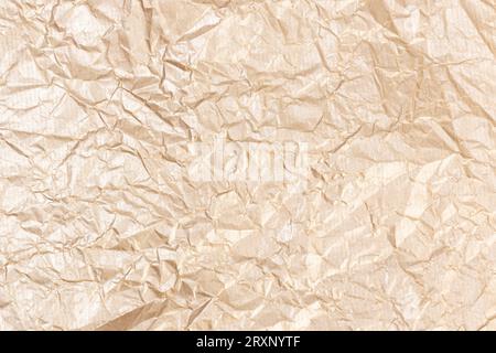 Golden crumpled paper texture background. Full frame Stock Photo