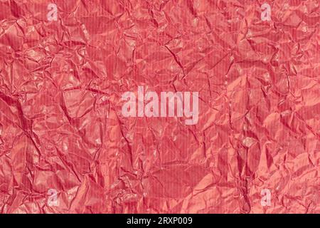 Red crumpled paper texture background. Full frame Stock Photo