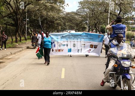 Nakuru, Kenya. 26th Sep, 2023. People march while holding a banner during the national celebrations of The World Contraception Day. According to data from Kenya Demographic and Health Survey (KDHS) Kenya has made significant progress in promoting access to family planning and increasing modern contraceptive prevalence rate from 53% in 2014 to 57% in 2022, with unmet need for family planning reducing slightly from 18% to 14% while teenage pregnancy has fallen from 18% to 15%. Credit: SOPA Images Limited/Alamy Live News Stock Photo
