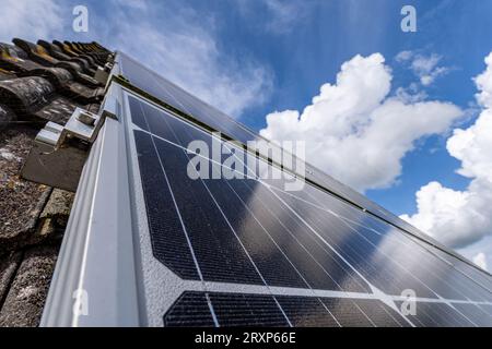 roof-mounted solar collectors on residential house Stock Photo