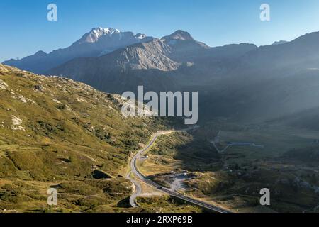 Aerial view over Simplon mountain pass, drone shot, camper vans park near old Spittel, Switzerland Stock Photo