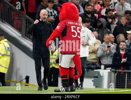 MANCHESTER, UK. 26th Sep, 2023. Erik ten Hag manager of Manchester United greets Fred the Red club mascot during the Carabao Cup match at OLD TRAFFORD, MANCHESTER. Picture credit should read: Andrew Yates/Sportimage Credit: Sportimage Ltd/Alamy Live News Stock Photo