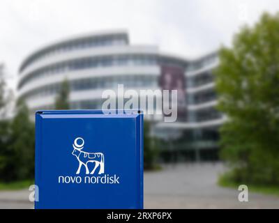 Corporate headquarters of Novo Nordisk. Selective focus on sign. Building blurred. A pharmaceutical company headquartered in Denmark. Copenhagen, Denm Stock Photo