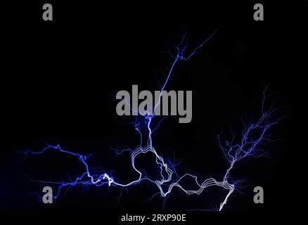 Electrical lightning bright white blue sharp electric energy detail on black background. Power generation, electricity, high voltage abstract concept, Stock Photo