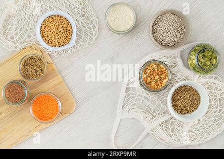 Grocery in bowls. Protein pulse and groats that is dried and then soaked and cooked before eating. Vegetarian organic product. Top view. Stock Photo