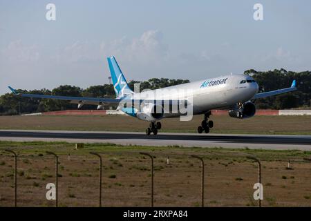 Air Transat Airbus A330-343 (REG: C-GTSD) arriving early morning directly from Canada for maintenance at LTM. Stock Photo