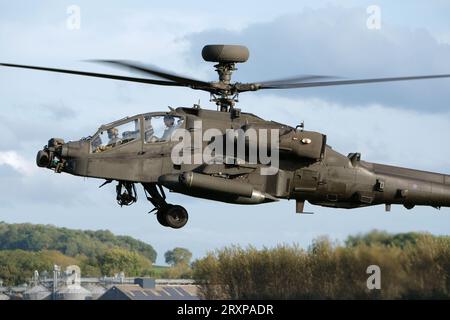 British Army Air Corp ( AAC ) Apache AH1 attack helicopter in flight in September 2023 based at Wattisham Suffolk UK Stock Photo