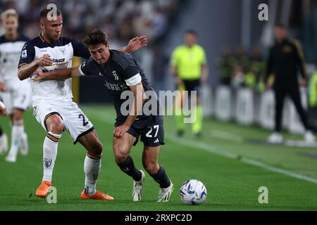 Torino, Italy. 26th Sep, 2023. Andrea Cambiaso of Juventus Fc and Alexis Blin of Us Lecce battle for the ball during the Serie A match beetween Juventus Fc and Us Lecce at Allianz Stadium on September 26, 2023 in Turin, Italy . Credit: Marco Canoniero/Alamy Live News Stock Photo