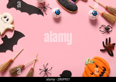 Frame made from Halloween decorations on pink background Stock Photo