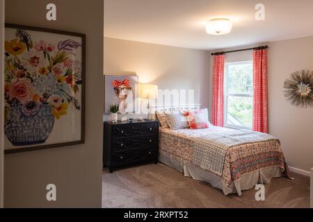 Furnished contemporary bedroom in a townhome. Home decorating or real estate concept. Stock Photo