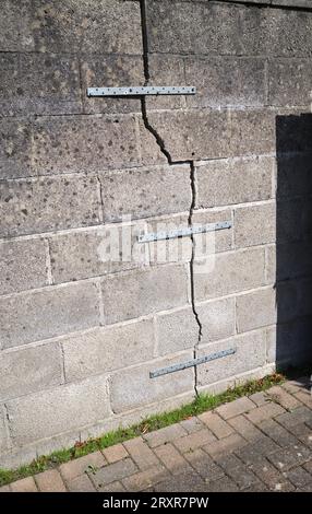 Makeshift crack repair on residential wall of a house in Penarth South Wales UK Stock Photo