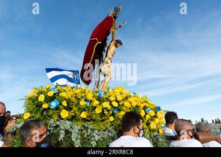 Salvador, Bahia, Brazil - December 31, 2021: Statue of Jesus Christ, the lord of sailors, being taken to the Galiota boat on Boa Viagem beach, in the Stock Photo