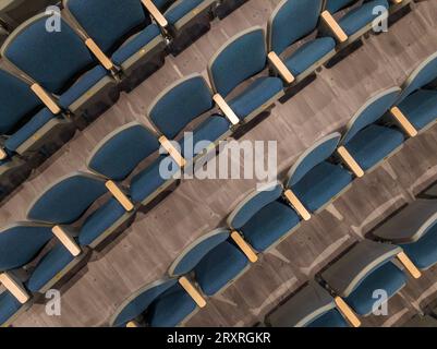 Overhead view of empty gray and blue theater, auditorium seats, chairs. Stock Photo