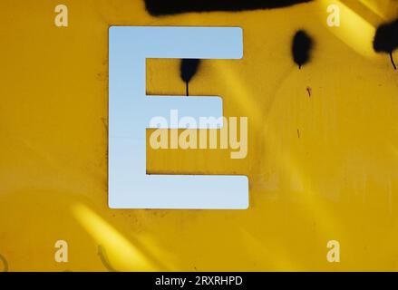 Old worn letter e, showing its age, pattern, lines and boldly grabbing attention.  Be noticed with this single letter, Stock Photo