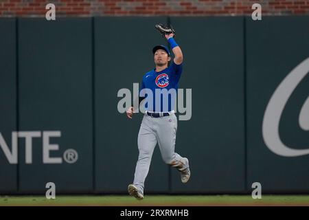 Seiya Suzuki of the Chicago Cubs makes a thumbs-up gesture on base after  hitting a double during the fourth inning of a baseball game against the  Los Angeles Angels at Angel Stadium