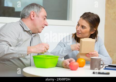businessman and woman having lunch Stock Photo