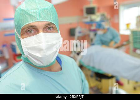 male surgeon in mask looking at camera Stock Photo