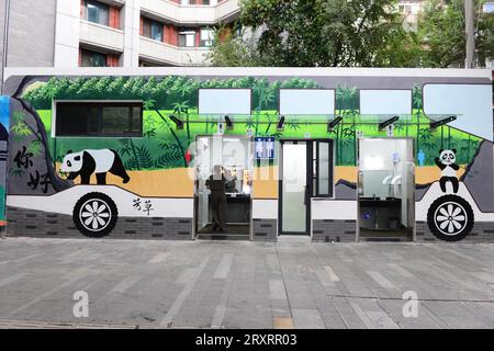 A public toilet with the bus graffiti on its exterior wall appears in Chengdu City, southwest China's Sichuan Province, 26 September, 2023. Stock Photo