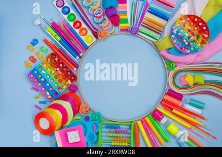 Stationery for teaching children to draw. Kids school supplies in the form of a round frame for draw and make DIY crafts. Stock Photo