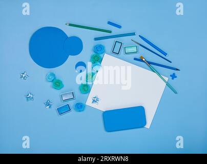 Crafting supplies on the table in a workshop. DIY accessories top view. Tools and accessories for DIY  homemade crafts. Artist workspace concept mock Stock Photo