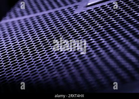 close up of a metal grid in cold tones. Abstract background. Selective focus Stock Photo