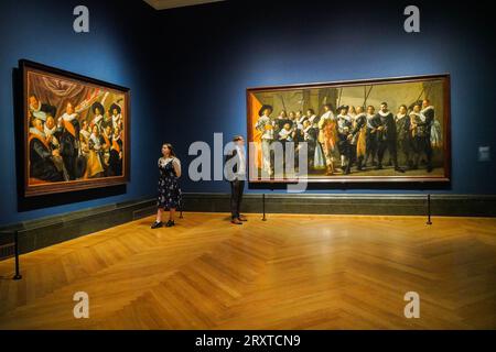 London UK. 27 September 2023.    L-R  Banquet of the Officers of the St George Civic Guard abourt 1627, Oil on canvas.  Militia Company District XI under the command of Captain Reynier  Reael , known as 'The Meagre Company', 1633 , (completed by Pieter Codde , 1637). The Credit Suisse Exhibition  opening at the National Gallery is the first large-scale monographic exhibition devoted to the 17th-century Dutch portrait painter for a generation. The exhibition runs at the Naitonal gallery from 30 September to 21 January Credit amer ghazzal/Alamy Live News Stock Photo