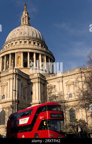 London, UK - January 15 2023: A red double decker bus passing by St Paul's Cathedral in London on a sunny late afternoon Stock Photo