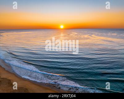 Sunrise seascape with clear skies at Shelly Beach on the Central Coast, NSW, Australia. Stock Photo