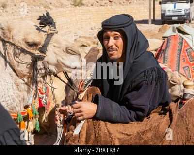 Camel and rider, Petra Archaeological Park, UNESCO World Heritage Site, one of the New Seven Wonders of the World, Petra, Jordan, Middle East Stock Photo