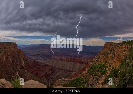 Lightning striking inside the Grand Canyon during the 2023 Arizona Monsoon season, viewed from No Name Overlook, Grand Canyon National Park Stock Photo