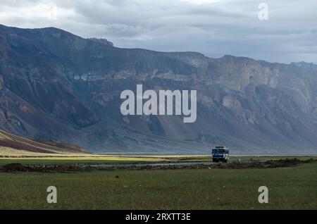 Bus in the Himalaya landscape of Ladakh Stock Photo