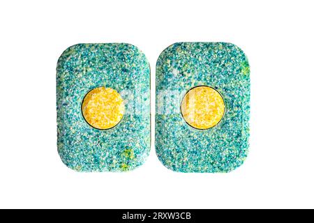 two solid tablets for washing dishes in a dishwasher on a white background. High quality photo Stock Photo